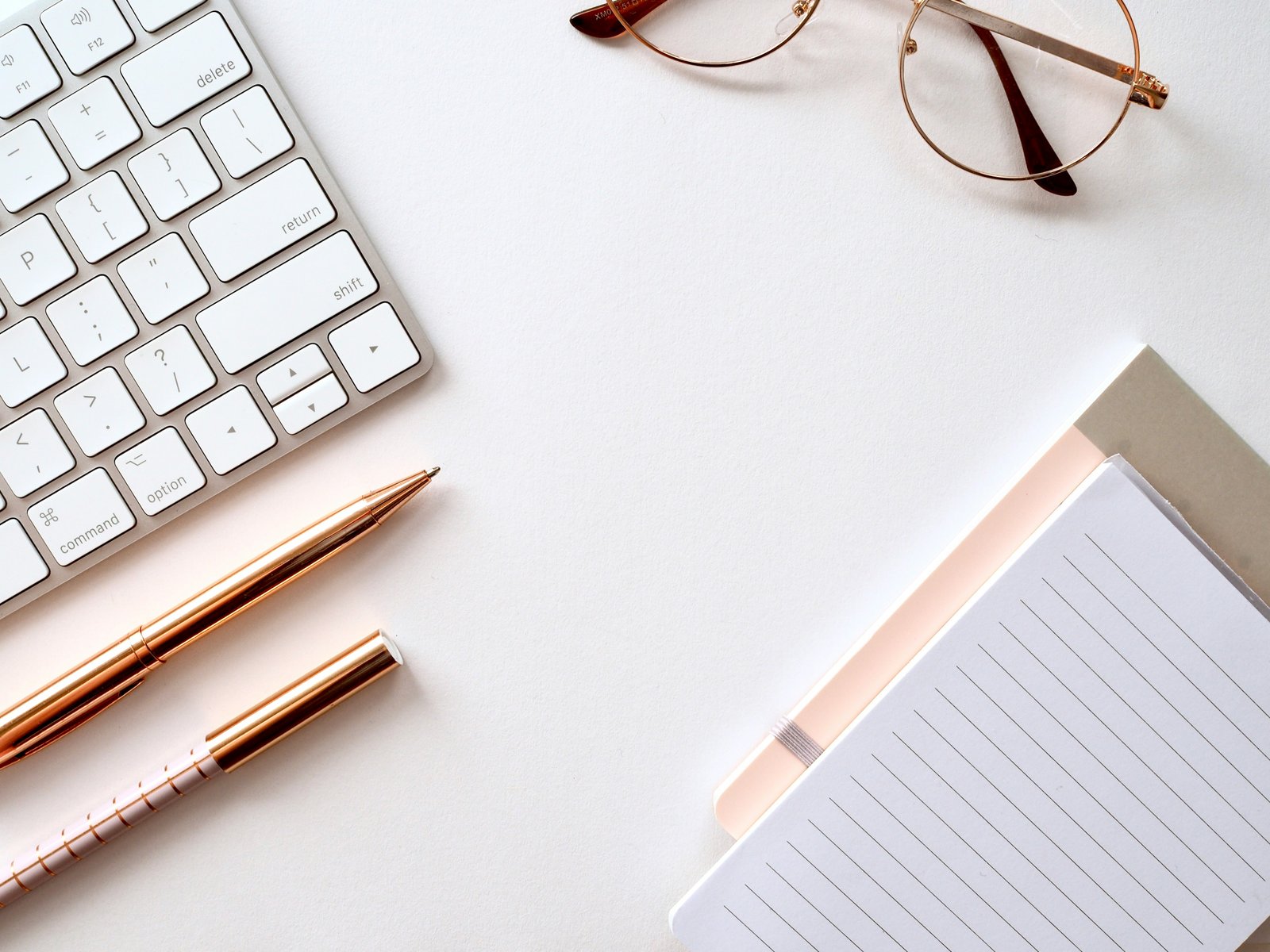 Desk with stationery and glasses representing business advice and decision-making