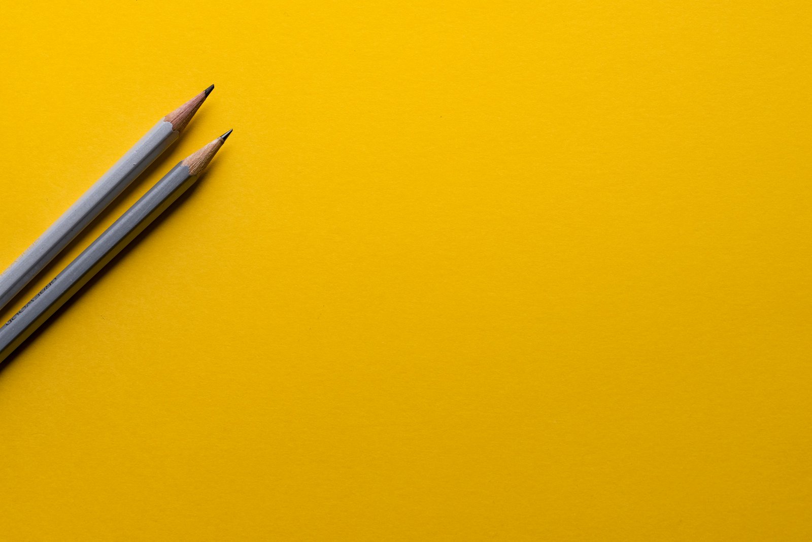 Pencils on a yellow background representing planning and initiatives